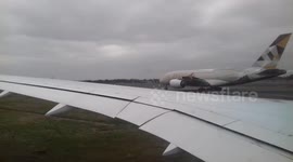 Plane takes off from snowy Heathrow