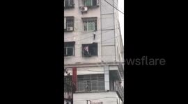 Good Samaritans rescue boy hanging from third-floor window