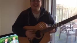 Big kid tries to play guitar