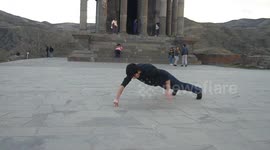 Bruce Lee-inspired man pulls off two-finger push-ups at ancient Armenian temple
