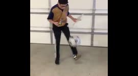 Boy solves Rubik's Cube with one hand while dribbling soccer ball