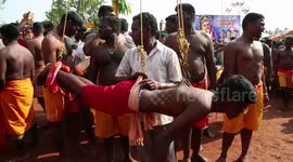 Hindu devotees pierce themselves with hooks in south Indian festival