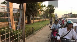 Dozens of motorcyclists taking a shortcut by riding on pavement