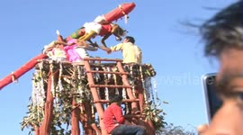 Indian devotees hang in air to worship tribal god