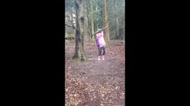 Girl falls off rope swing in forest