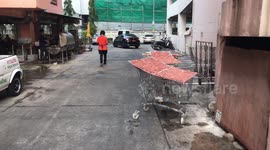 Thai restaurant using SHOPPING TROLLEYS to dry meat
