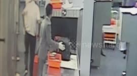 Airport security guard caught stealing cash from 89-YEAR-OLD tourist
