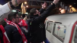 Football fans challenge each other in London underground