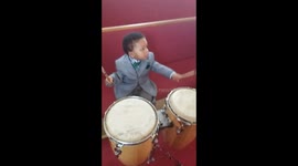 Baby J Playing the drums