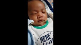 Baby laughing while dreaming