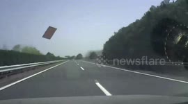 Dash-cam video captures moment flying iron plank smashes windscreen