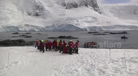 Tourists hiking on D'Hainaut Island, Antarctic Peninsula