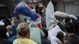 Scores take part in mass pillow fight in London