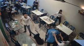 Diners use chairs and glasses as weapons in shocking restaurant brawl