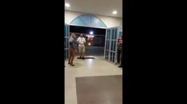 Cross being carried into a church by a drone