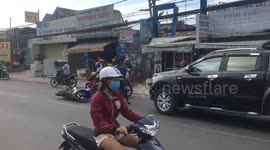 Two young men fighting because of a motorbike crash