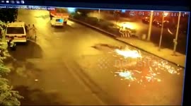 Sparks fly as bike skids on road at high speed