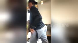 Heartwarming moment teenager clears up after his school's janitor at restaurant