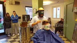 Italian barber performs blindfolded haircut