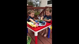 Twins Coloring Eggs