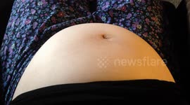 Baby moves in moms belly