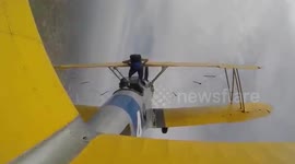 Woman drops from UPSIDE-DOWN biplane for California skydive