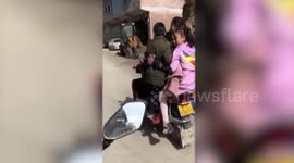 Chinese man caught carrying 6 children on motorbike
