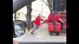 Special delivery service! London postmen filmed pushing colleagues on trolley
