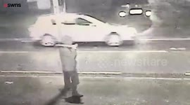 Man walking down a street holding a 'SHOTGUN,' moments before he was shot dead