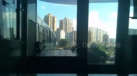 Train runs through building in China