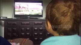 Baby greets mom watching tv
