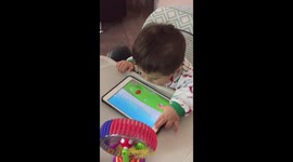 Cute baby playing with tablet