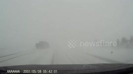Dashcam captures truck nearly hitting van head-on during blinding snowstorm