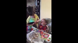 Boy sings to his little brother