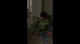 Baby playing with a xylophone