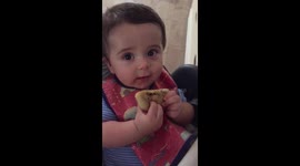 Baby eating alone