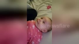 Too cute! Baby attempts to sing along with mother