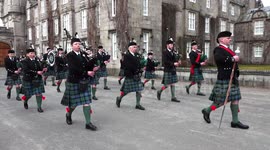 Ballater Pipe Band parade in front of Balmoral Castle in Royal Deeside, Scotland, April 2018