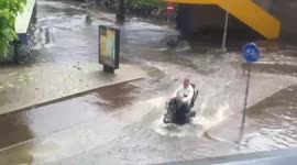 Man conquers floodwater on mobility scooter