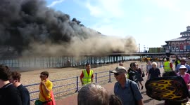 Eastbourne pier smoke before fire flames