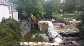 Storm damage repair to protect old village bridge at  Horrabridge devon
