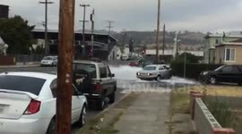 only in Oakland: drunk lady crashes mid 90's benz. fire hydrant gusher. the Burns!