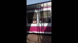 Heavily Crowded Mumbai Railway, People hanging at the doors