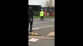 Kid taken away by police at scene of fire