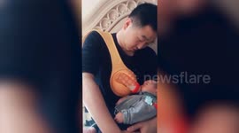 Chinese dad 'breast feeds' baby