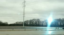 Video captures power lines crossing and flashing in blizzard winds