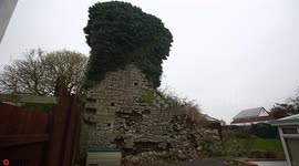 Man concerned that ancient castle wall will fall on his house as stones begin to crumble away