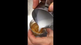 Tiny Tulips latte art in an espresso cup for a short macchiato topped up coffee