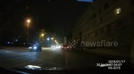 Car slides across road into oncoming traffic in icy conditions in Riga, Latvia
