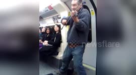 Newsflare Edit - London has the best drunk tube riding busker in the world!